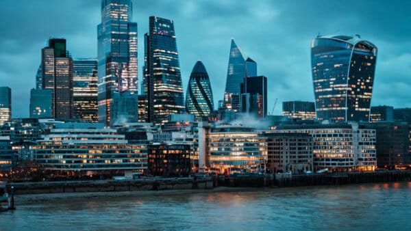 London's financial district at dusk, one of two hubs for the European AI consultancy Anthropic is backing with private equity firm Hg